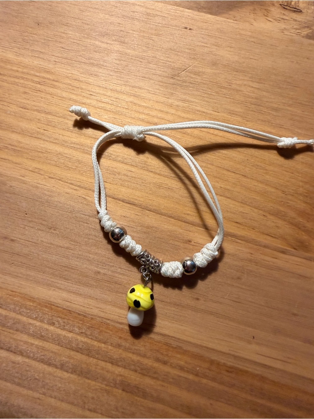 White Cord Bracelet with Yellow Mushroom Charm